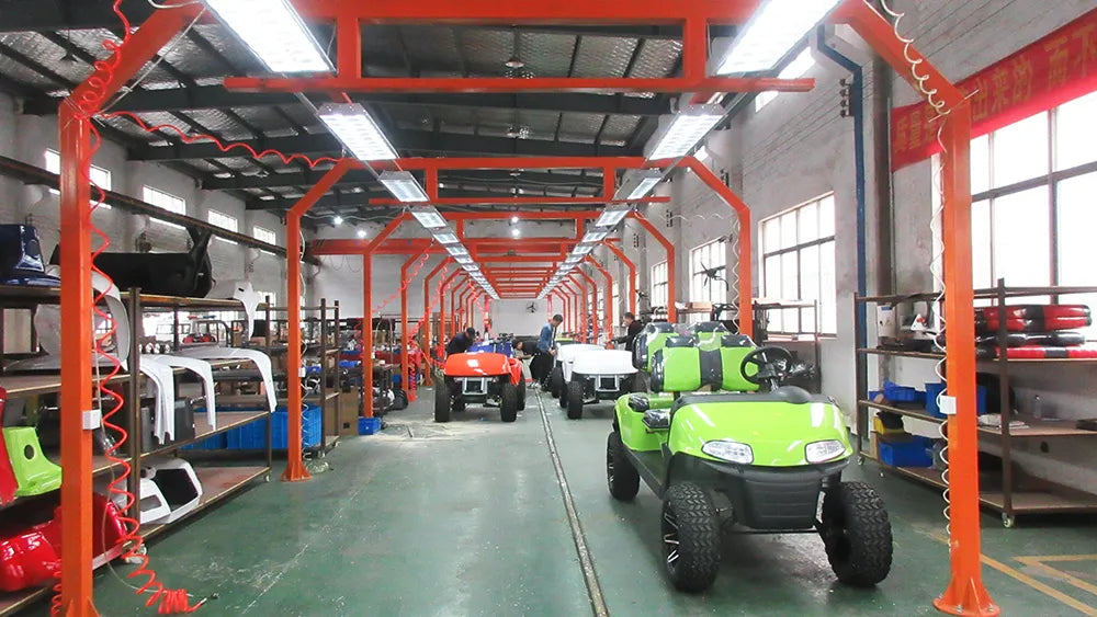 Final quality check station where technicians inspect finished electric golf carts before shipping